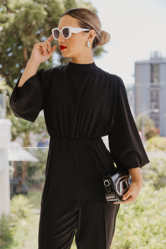 Black jumpsuit with loose wrap skirt
