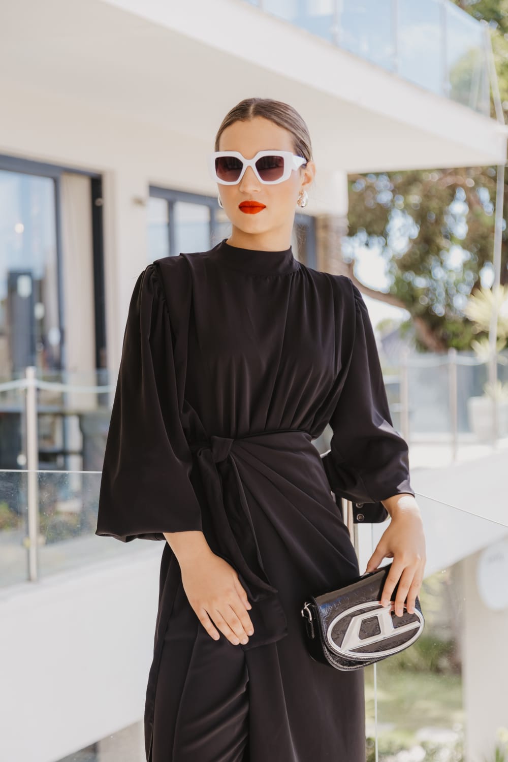 Black jumpsuit with loose wrap skirt